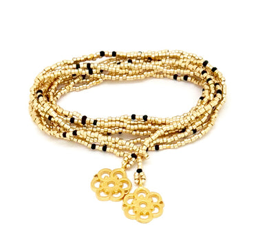 Collar enredable dorado detalles negros.
